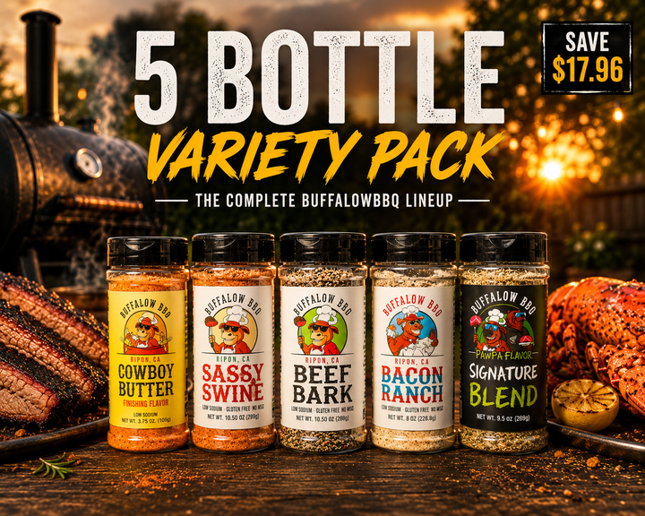 BuffalowBBQ Ultimate BBQ Rub Variety Pack featuring all five handcrafted seasonings with smoked brisket, grilled steaks, seafood, and vegetables beside a backyard smoker at sunset.