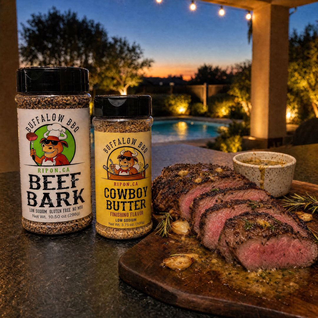 BuffalowBBQ Beef Bark and Cowboy Butter seasoning bottles beside seared ribeye steaks with garlic butter and rosemary.